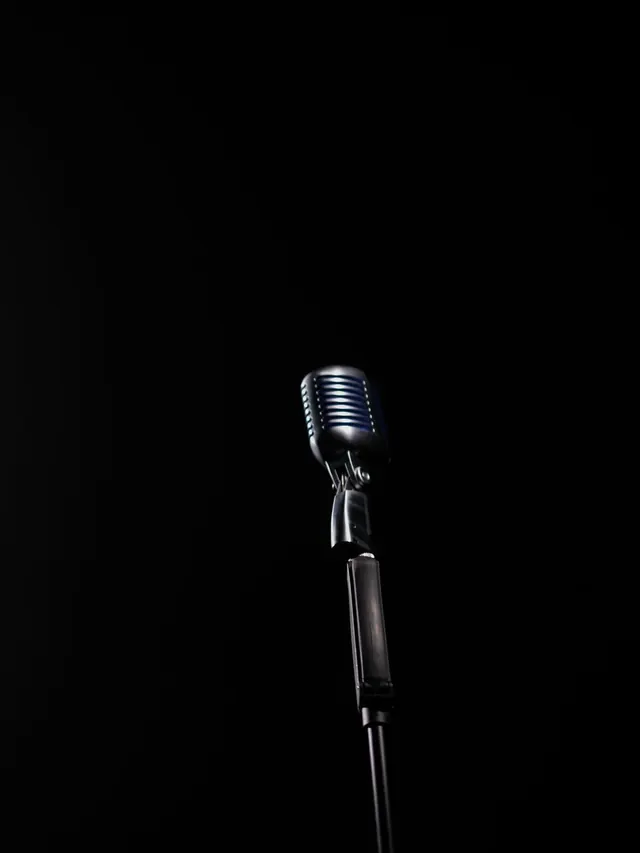 A microphone waiting in a spotlight